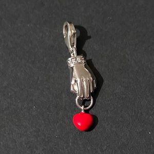 Thomas Sabo sterling silver hand holding an enamel heart Charm